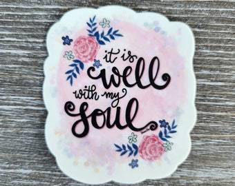 May include: A pink and white watercolor sticker with a floral design and the text "it is well with my soul".