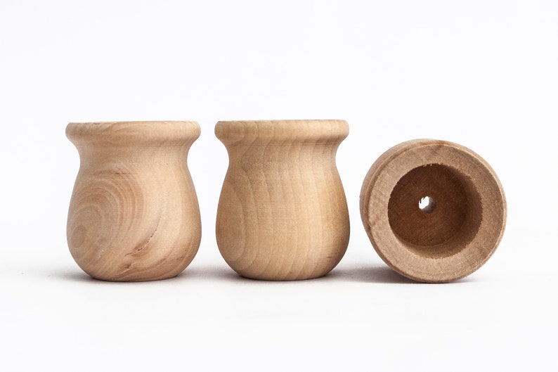 wooden peg dolls in cups
