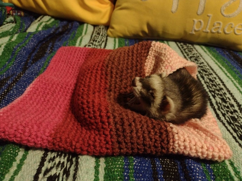 small crocheted ferret tunnel in pink and burgundy stripes - so cozy