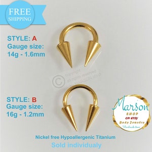 May include: Two gold-coloured titanium body jewellery pieces with pointed ends. The piece on the left is 14 gauge and 1.6mm in size. The piece on the right is 16 gauge and 1.2mm in size. Both pieces are nickel-free and hypoallergenic. The text "Sold individually" is visible below the jewellery.