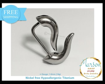 May include: A pair of silver titanium curved barbell earrings with a 1.6 mm gauge. The earrings are nickel free and hypoallergenic. The text "Gauge: 1.6mm (14g)" and "Nickel free Hypoallergenic Titanium" is visible in the image.
