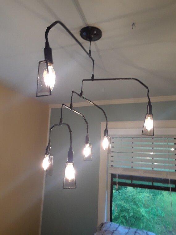 Black Hanging Mobile Ceiling Light Fixture With 6 Lights And Beveled Glass Shades