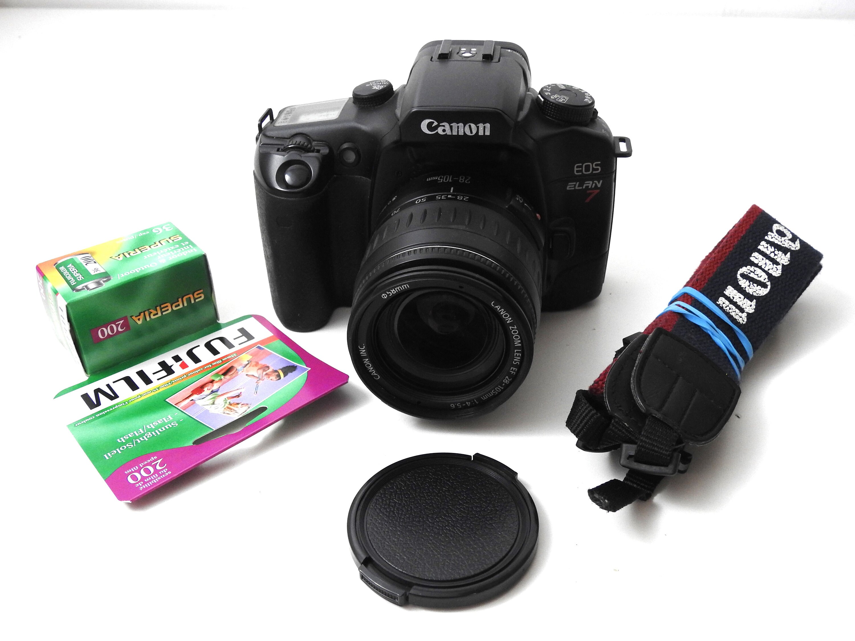 Canon EOS ELAN with lens, strap, and battery