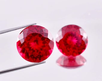 1 par de rubis naturais de Moçambique, cor vermelho-sangue-de-pombo, lapidação redonda, certificados pelo GIT, qualidade AAA+, ideais para confecção de anéis e joias.