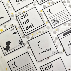 May include: A set of white square stickers with black outlines and various computer-related icons and text. The icons include a dinosaur, a loading symbol, a sad face, and a QR code. The text includes "ctrl alt del", "Restarting", and "Page Not Found".