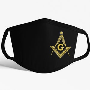 May include: Black face mask with a gold embroidered Masonic symbol, featuring a compass and square with a 'G' in the center.