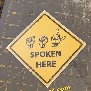 ASL Spoken Here road sign style sticker