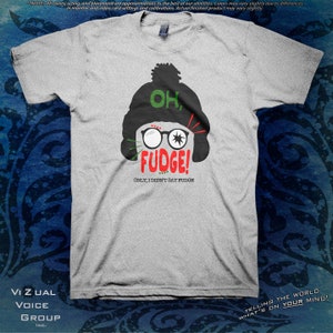May include: Gray t-shirt with a cartoon illustration of a person wearing a black hat and glasses. The text on the shirt reads "Oh, Fudge! Only, I didn't say fudge."