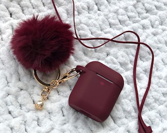 Cute Silicone Burgundy Protective Airpods Case with Fur Ball Pom Pom Keychain Accessory for Apple Airpods Generation 1, 2 and Pro