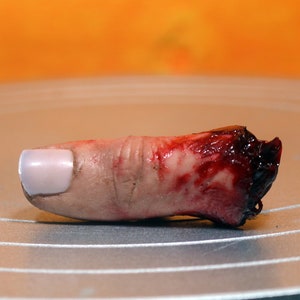 Bloody severed thumb. Perfect halloween decoration or horror prop