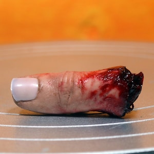 Bloody severed thumb. Perfect halloween decoration or horror prop