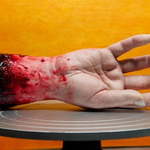 Bloody severed hand, silicone, realistic.  Great for Halloween decoration, haunted house or horror prop