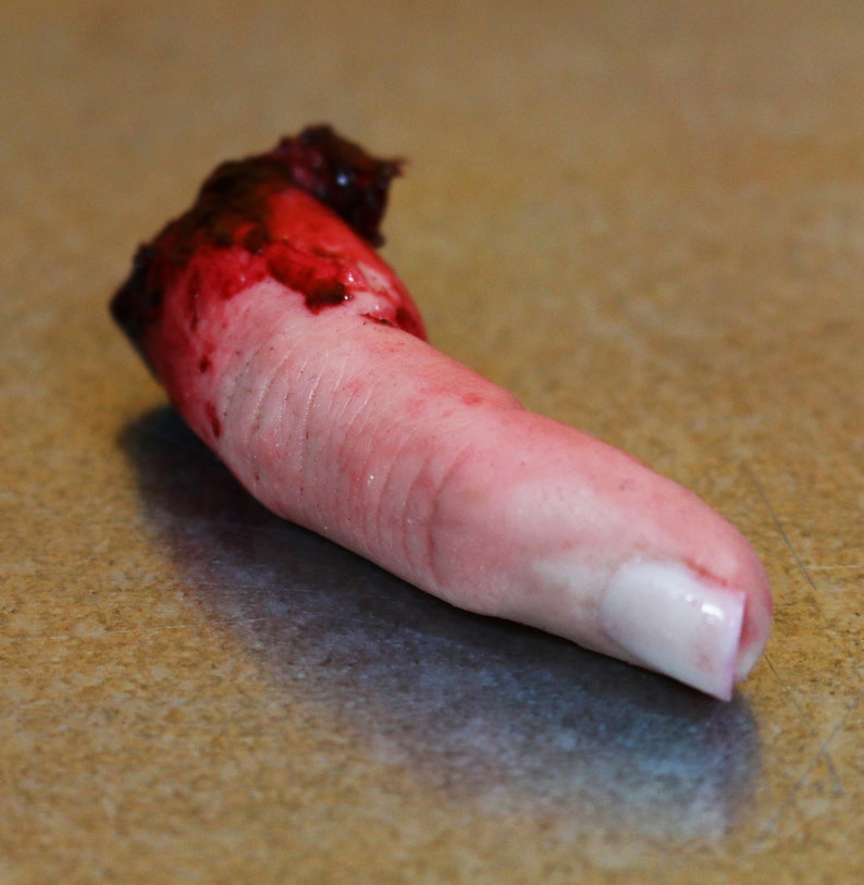 Bloody severed finger. Halloween decoration, gag gift, pranks or horror prop 