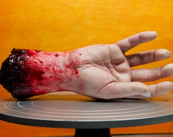 Bloody severed silicone hand, realistic.  Great for Halloween decoration, haunted house or horror prop