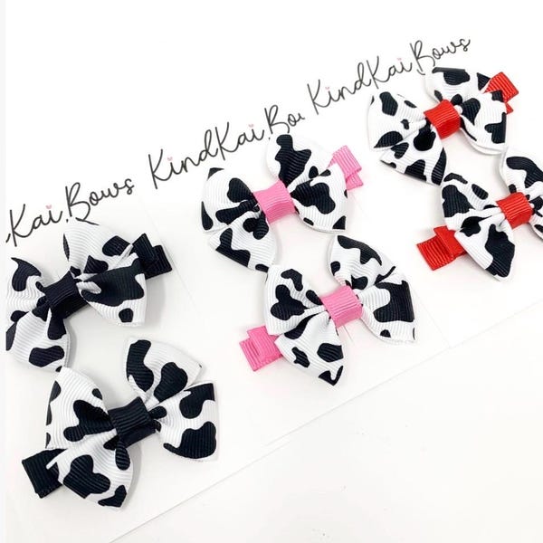 Cow print small hair bows, toddler pigtail bows, pink cow print, red cow print, country western bows. farm theme bows, country western theme