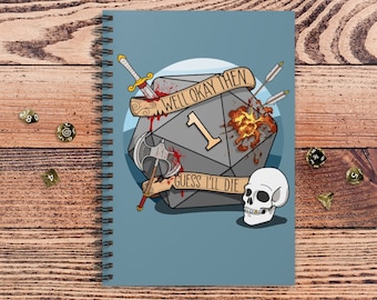 May include: A blue notebook with a spiral binding features a gray 20-sided die with a red 1 on it. The die is surrounded by a sword, an axe, and arrows. The die is also on fire and has blood dripping from it. The text "Well okay then" and "Guess I'll die" are written on the die. A white skull is below the die.