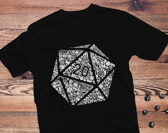 Puede incluir: Camiseta negra con un gráfico blanco de un dado de 20 caras hecho de dados más pequeños y otros símbolos de juego. El dado tiene el número "20" en el centro.