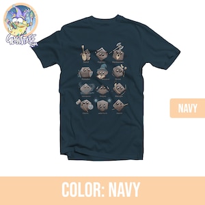 May include: A navy blue t-shirt with a graphic of Dungeons and Dragons character classes represented as dice. The text on the shirt reads "Bard, Fighter, Barbarian, Paladin, Wizard, Druid, Sorcerer, Rogue, Ranger, Cleric, Warlock, Monk".