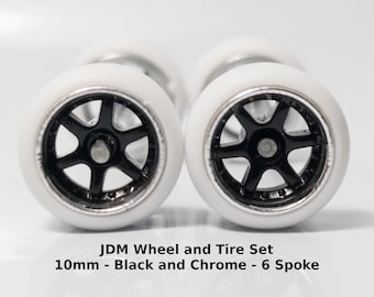 10mm/10mm JDM Black and Chrome rims with White tires 6 spoke rubber tire set.