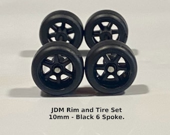 10mm/10mm JDM Metallic Black 6 spoke rubber tire set.