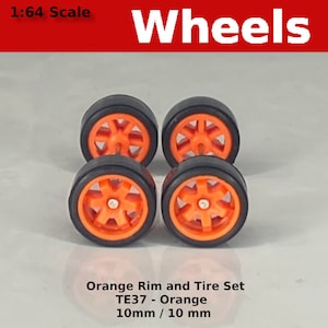 May include: Set of four 1:64 scale orange rim and tire wheels. The wheels have a black rim and an orange tire with a spoke design. The wheels are 10mm in diameter.