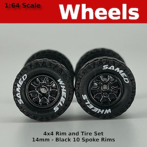 May include: Set of four 1:64 scale black 10-spoke rims with tyres. The tyres are black with white lettering that reads "WHEELS" and "SAMED".