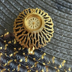 Caravelle Gold-Tone Round Pendant Watch with Tassel Charm il_fullxfull.6106190591_gu8j.jpg main image 2