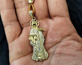 Rosarios Santa Muerte bañados en oro