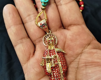 Rosarios Santa Muerte bañados en oro