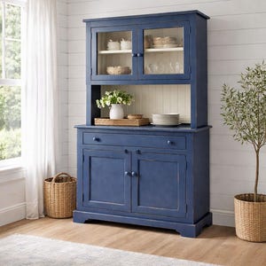 Farmhouse buffet and hutch displayed in coastal cottage dining room with glass door display cabinet.