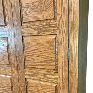Close-up of the handcrafted raised oak door panels on the Phoenix TV Cabinet, highlighting the texture, finish, and wood grain.