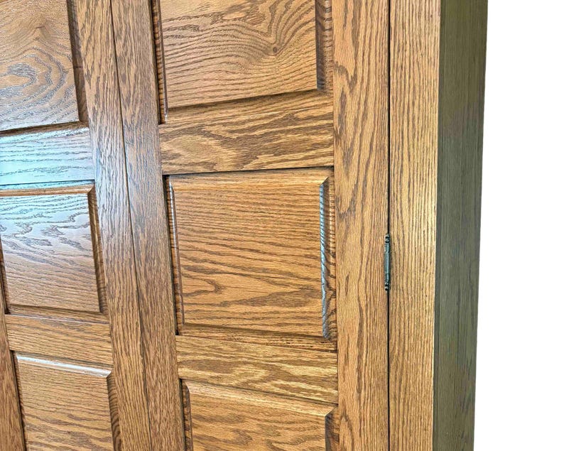 Close-up of the handcrafted raised oak door panels on the Phoenix TV Cabinet, highlighting the texture, finish, and wood grain.