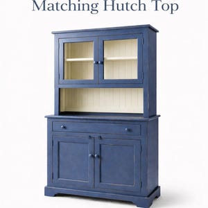 Farmhouse buffet with matching hutch top featuring glass doors and beadboard back panel.