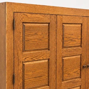 Side profile of wall mounted oak media cabinet showing slim 9-inch depth and solid wood construction.