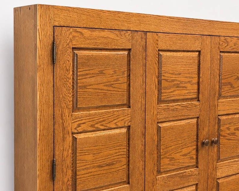 Side profile of wall mounted oak media cabinet showing slim 9-inch depth and solid wood construction.