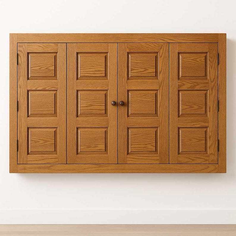 Handcrafted Phoenix TV Wall Cabinet made from rustic oak with raised-panel bi-fold doors and a Chestnut finish, mounted on a clean white wall.