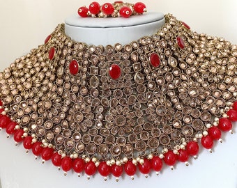 Red Asian/ Indian/ Pakistan Bridal set. Polki stoned bridal set with jhumka earrings.  Indian jewelry, bridal choker necklace, Bollywood,red
