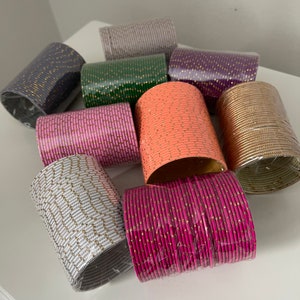 Plain gold dot metal bangles in 36 pack.  Choora or choori set