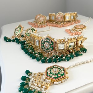 Indian Kundan choker set with earrings and tikka in multicolour,green,peach and pink.  Kundan choker set, Indian jewelry, Indian choker.
