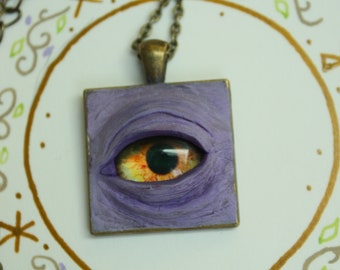 purple creepy glass eye pendant, square brass polymer clay necklace