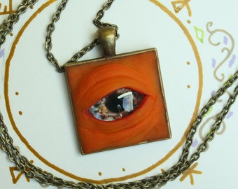 creepy colored eye pendant necklace, square bright orange glass eye