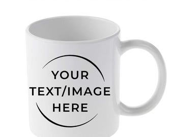 May include: A white ceramic mug with a curved handle. The mug features the text "CUSTOM MUG" at the top and a black semi-circle with the words "YOUR TEXT/IMAGE HERE" in the center. The mug is designed for custom printing.