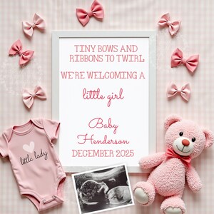 May include: A pink and white framed announcement with the text "Tiny bows and ribbons to twirl. We're welcoming a little girl. Baby Henderson December 2025". The frame is surrounded by pink bows and a pink teddy bear.
