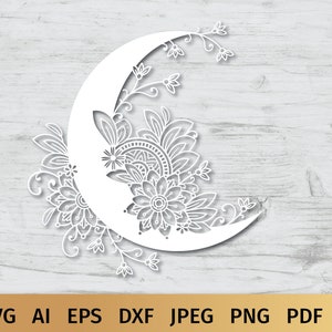 May include: A white crescent moon with intricate floral designs, perfect for crafting and decorating.