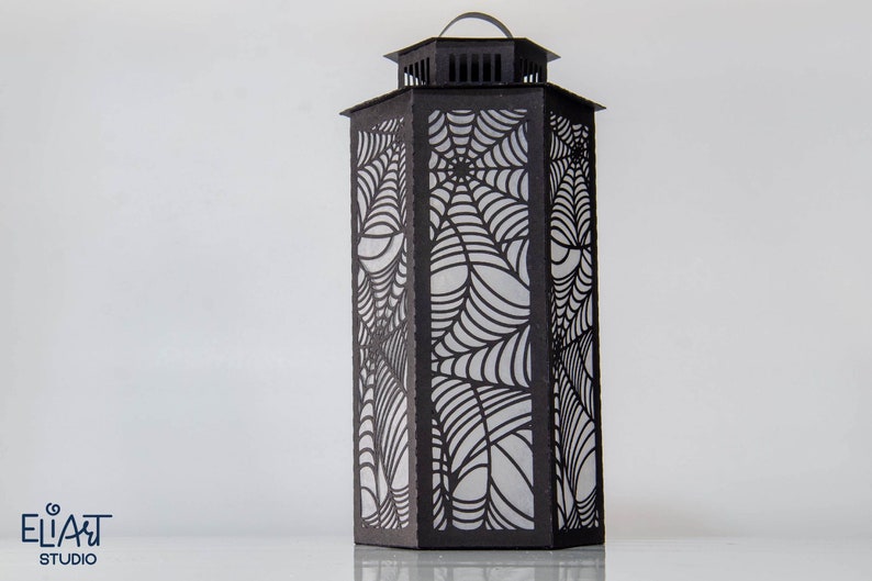 3d Halloween Paper Lantern SVG Design with Spider Web Pattern. This Led Candle Holder can be used for Home Decor and is Compatible with Cricut and Silhouette