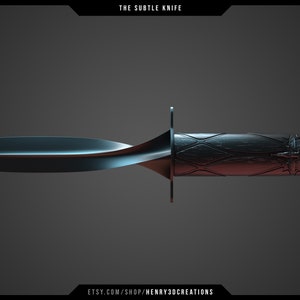 May include: A black knife with a curved blade and a wooden handle with a decorative design. The handle has a dark wood finish with a pattern of diamonds and a small metal design at the end. The knife is labeled "The Subtle Knife".
