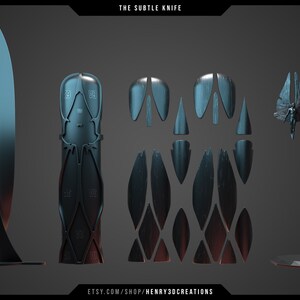 May include: A disassembled metal knife with a unique design. The knife is made up of multiple pieces, including a blade, handle, and a decorative stand. The knife is a dark blue color with a metallic finish.