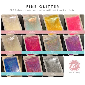 May include: A variety of fine glitter in small plastic bags, labeled with their color and type. The glitter is iridescent, holographic, or metallic. The bags are arranged in a grid pattern on a white background. The text "FINE GLITTER" is at the top of the image. The text "PET Solvent resistant, color will not bleed or fade." is below the title. The text "BnT Bold n Trendy" is at the bottom of the image.