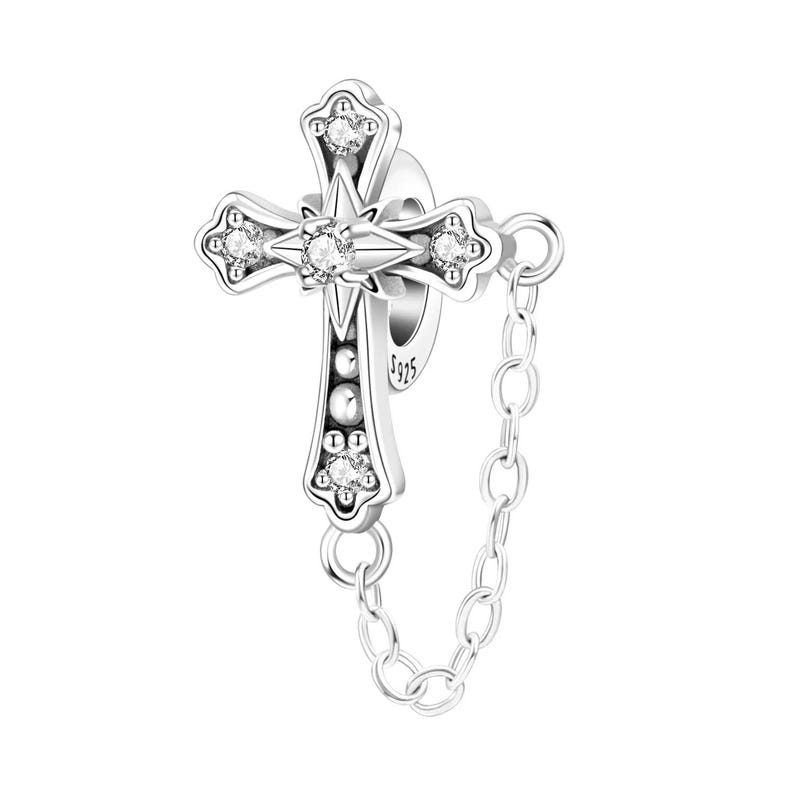 May include: A silver-colored cross charm with a starburst center and four clear, round gemstones. The cross is connected to a small chain. The charm is marked with "S925".
