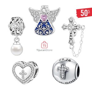 May include: A collection of silver-toned charm beads. The charms include an angel with a pink heart, a cross, a heart with a cross, a bead with a cross and the text "WITH GOD", and a floral bead with a pearl.
